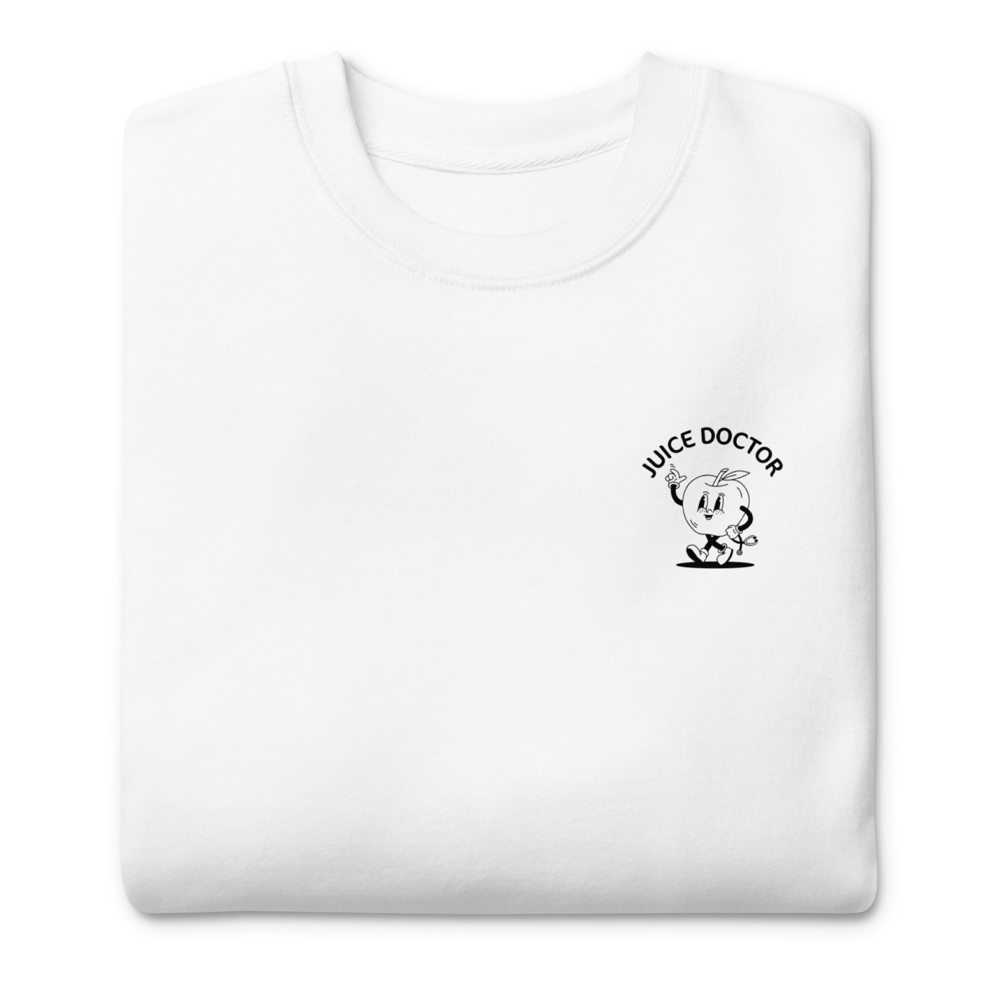 Folded white Juice Doctor unisex premium sweatshirt with black embroidered chest logo featuring cartoon apple character. Soft, cozy, and ready to wear