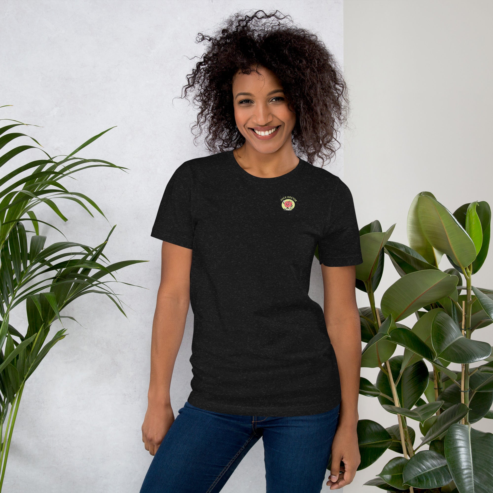 Model wearing black heather Juice Doctor unisex t-shirt with embroidered chest logo. Comfortable, fitted style perfect for casual wear and brand lovers.